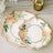 Floral paper plates in elegant shapes with gold accents and pastel flowers.