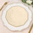 Gold-trimmed beige octagonal plate on a decorative white charger