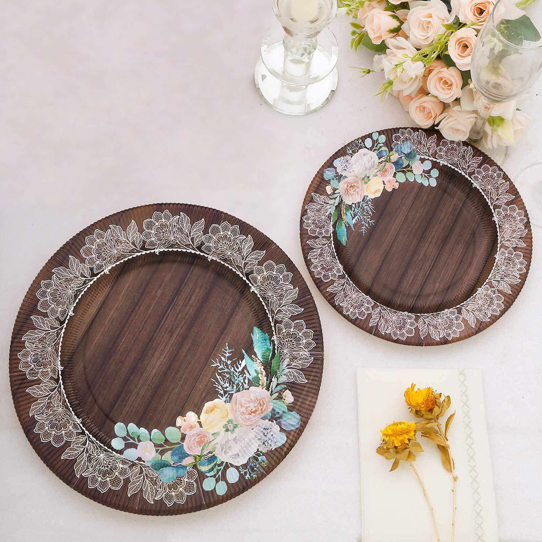 Decorative wooden plates with floral designs, perfect for elegant dining.