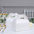 White takeaway boxes on a dining table with elegant decor.