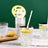 Clear glass with lemon slice and straw, filled with sparkling water.