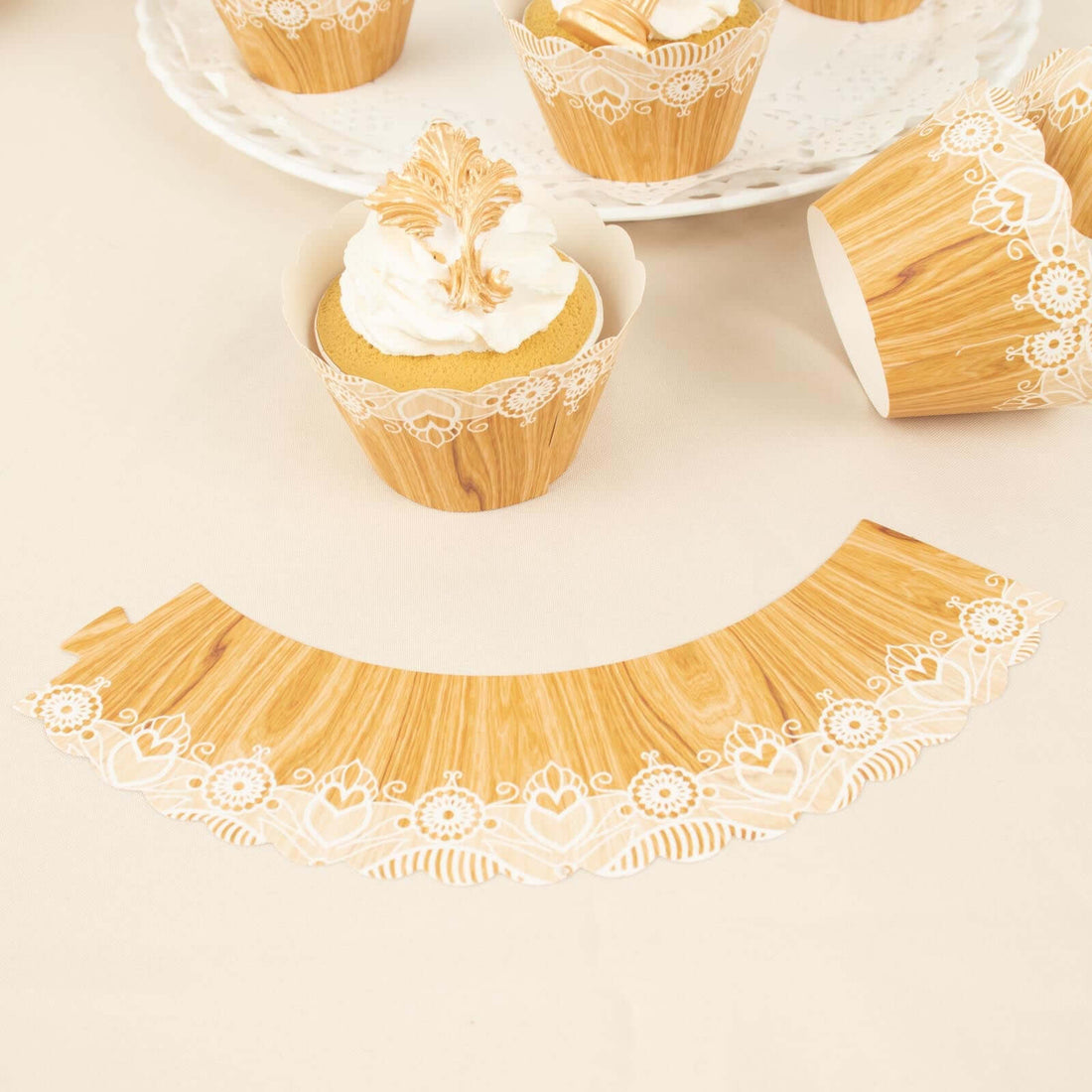 Decorative cupcake wrappers with lace design for baking and parties.