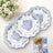 Three decorative blue and white plates arranged on a table.