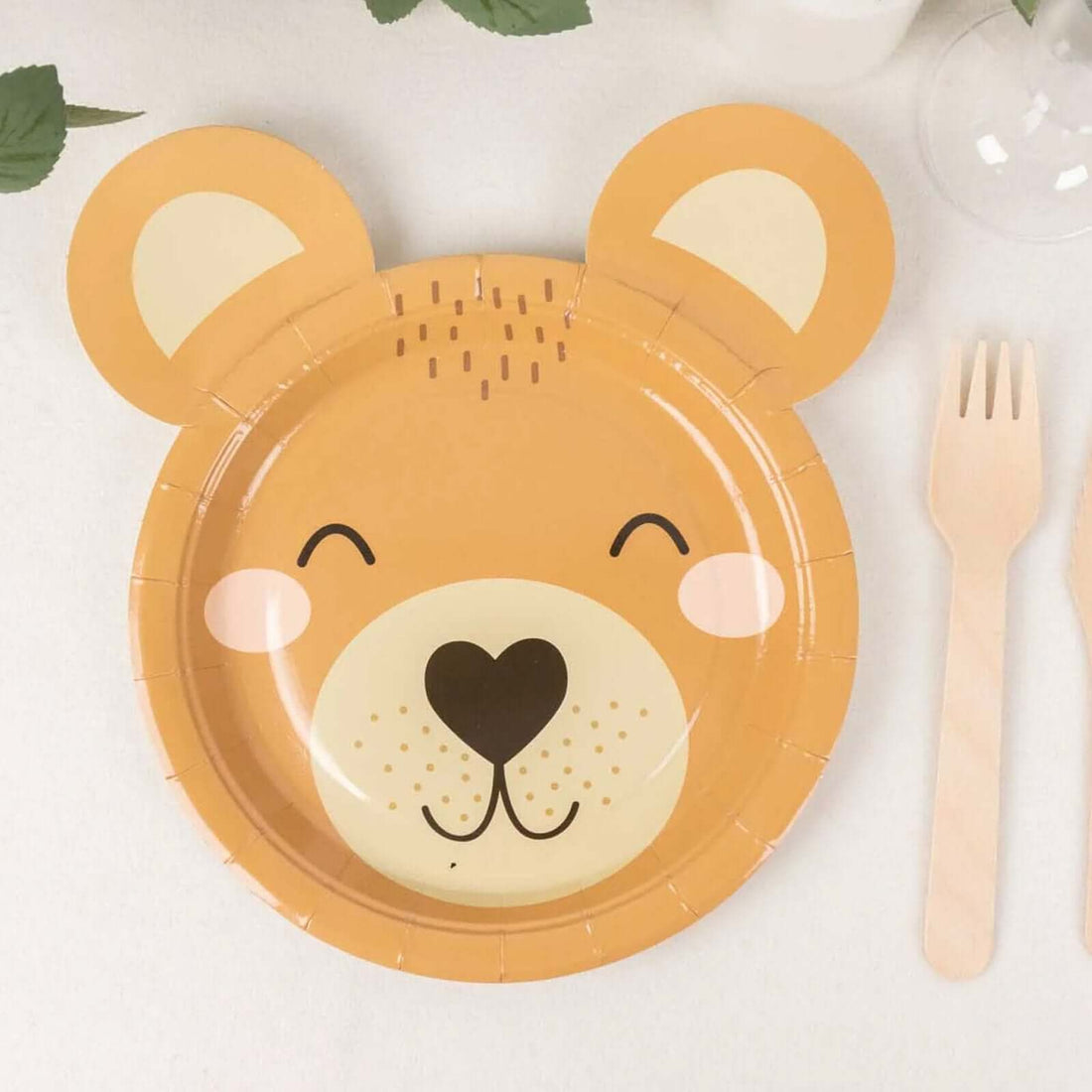 Bear-shaped children's paper plate with smiling face and ear design.