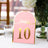 Pink table number 10 with gold accents on a table setting.