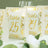 Elegant table number cards with gold foil accents for wedding decor.