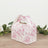 Floral patterned gift box with handle for special occasions.