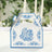 Decorative floral takeout box with blue design on white background.