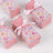 Pink butterfly-themed gift boxes with ribbons