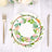 Floral paper plates stacked on a table with cutlery.