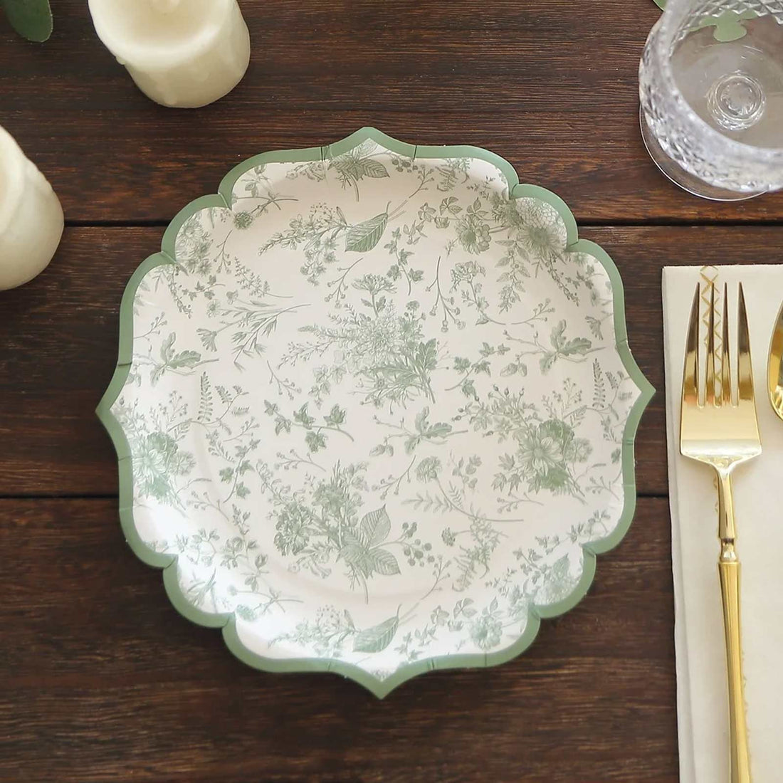 Decorative floral plate with green accents on a wooden table