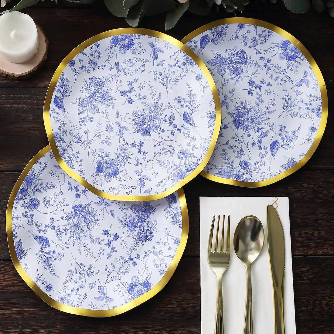 Blue floral design paper plates with gold rim, set of three.