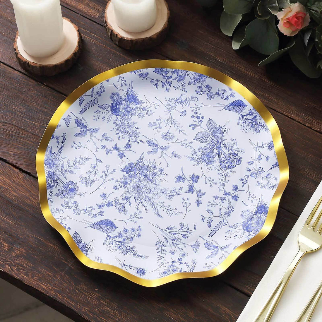 Floral patterned plate with gold rim on wooden table