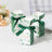 Green and white floral gift boxes with ribbons and "Thank you" text.