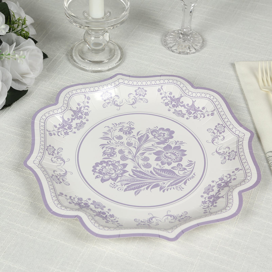 Decorative floral plate in lavender and white, perfect for elegant dining occasions.
