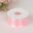 Pink satin ribbon spool for crafting and decoration