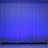 Blue illuminated backdrop with black stands in front.