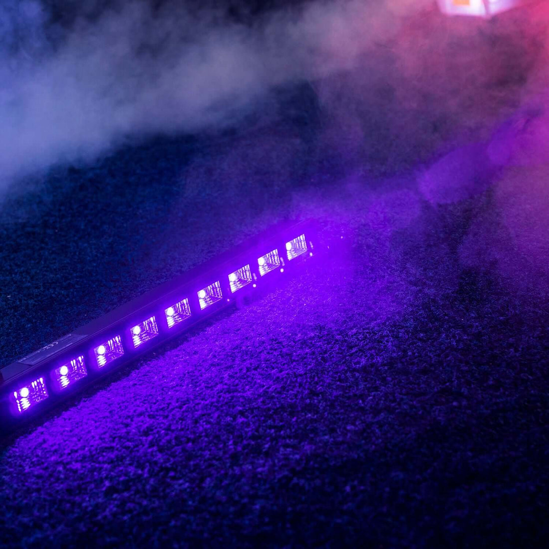 LED light bar with purple illumination and smoke effects.