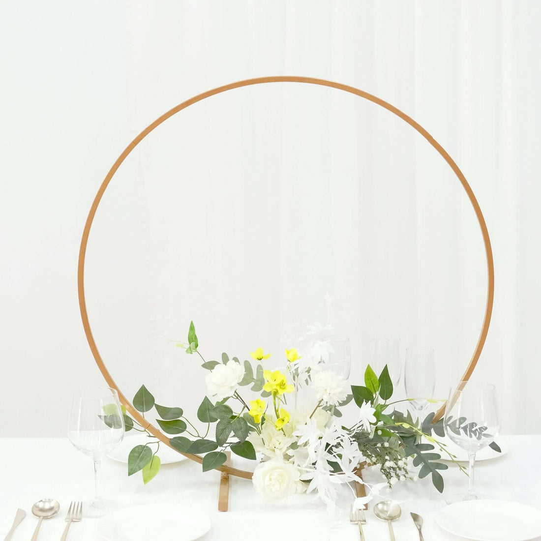 Decorative floral arrangement with circular frame for events or weddings