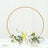 Decorative floral arrangement with circular frame for events or weddings