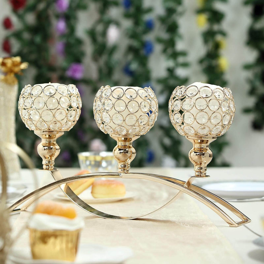 Elegant gold candle holder with crystal accents for table decor.