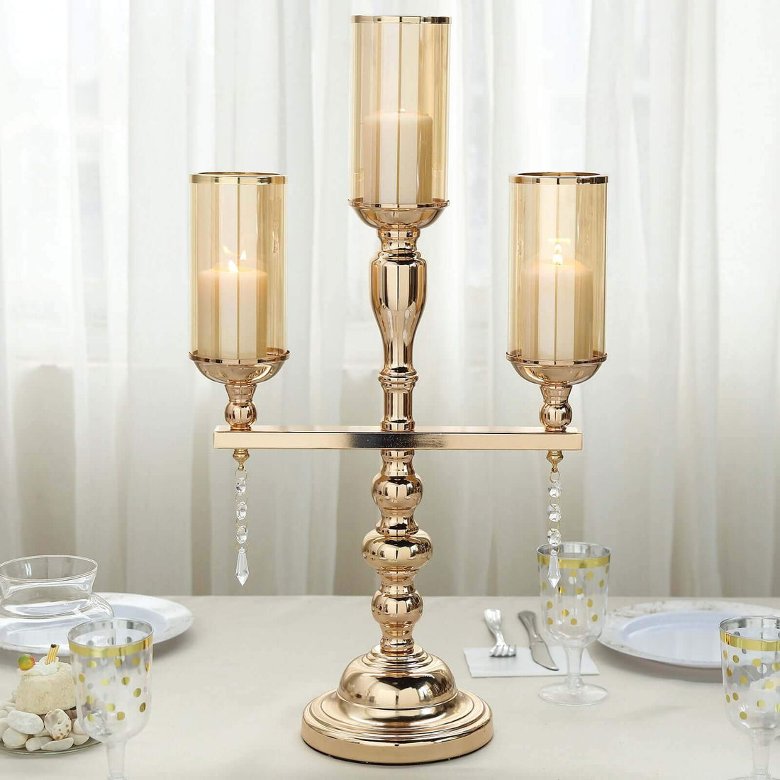 Elegant three-arm candle holder with glass shades and crystal accents.