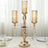 Elegant three-arm candle holder with glass shades and crystal accents.