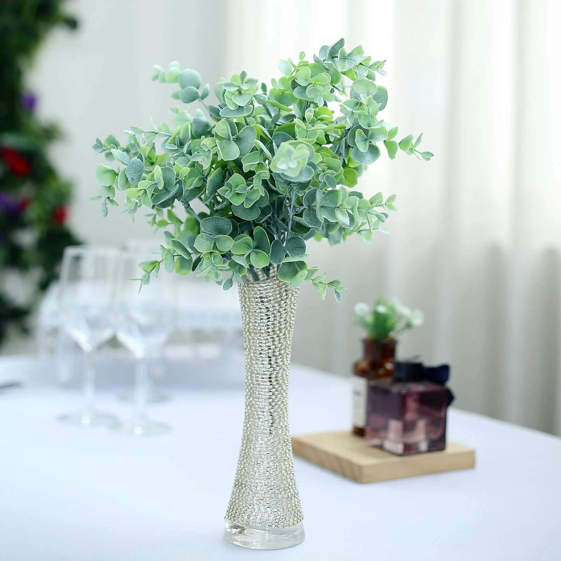 Artificial greenery in a decorative vase for home decor.