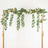 Artificial eucalyptus and rose garland on a gold frame