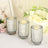 Set of three decorative glass candle holders with twinkling lights.