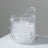 Crystal ice bucket with tongs and ice cubes inside