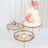 Elegant dessert stands with a wedding cake and assorted pastries.