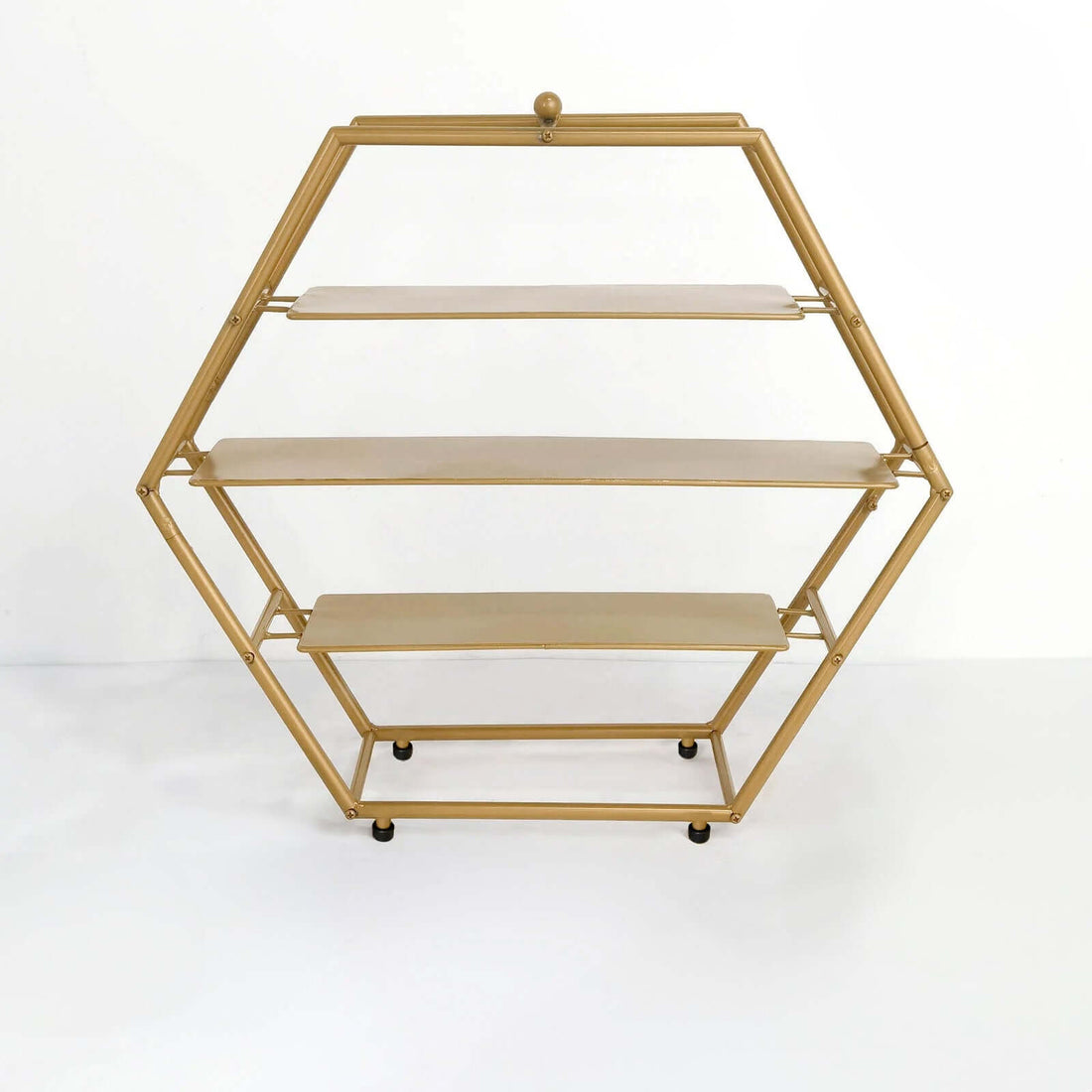 Gold hexagonal shelving unit with three shelves on wheels