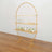Gold circular shelving unit with three wooden shelves for display.
