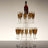 Elegant champagne tower with a bottle on top and filled flutes.