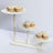 Assorted cupcakes displayed on a tiered wooden stand.