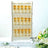 Champagne flutes display on elegant stand with floral decor