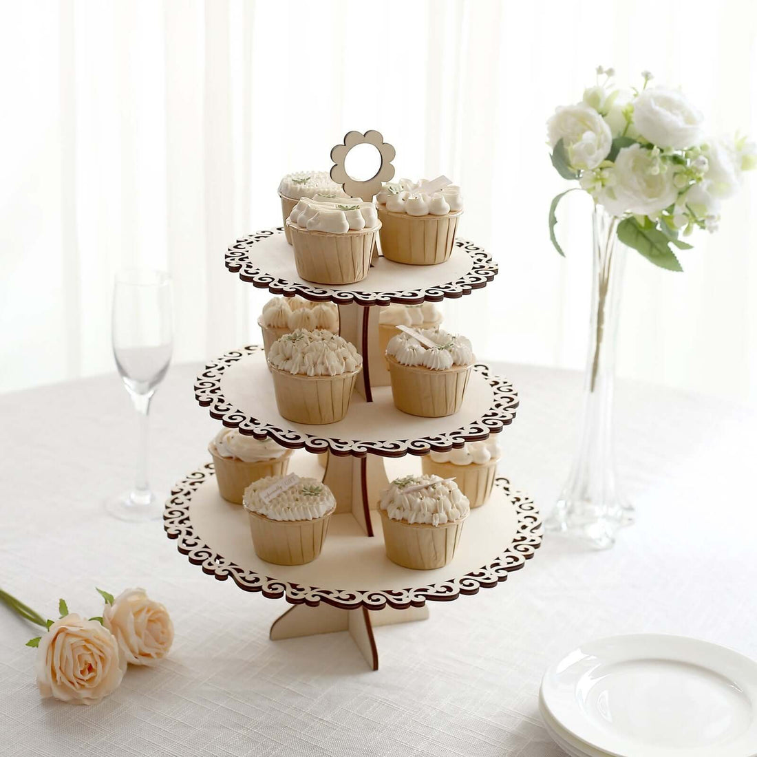 Elegant cupcake stand displaying beautifully frosted cupcakes.