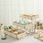Wooden cupcake stand with decorative layers holding assorted cupcakes.