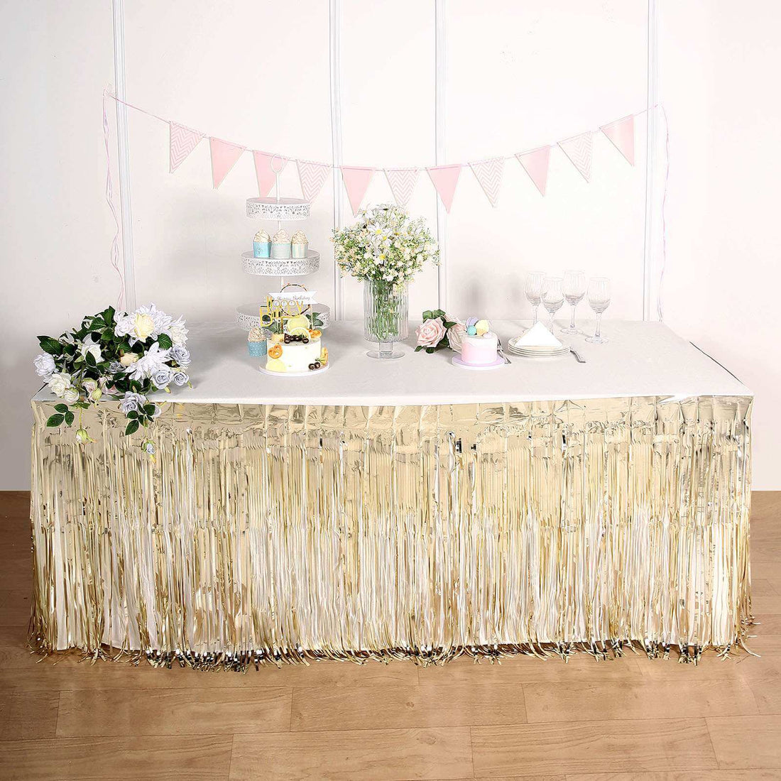 Gold fringe table skirt for parties and events, enhancing festive decor.