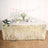 Gold fringe table skirt for parties and events, enhancing festive decor.