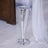 Silver disco vase with a sleek, modern design.