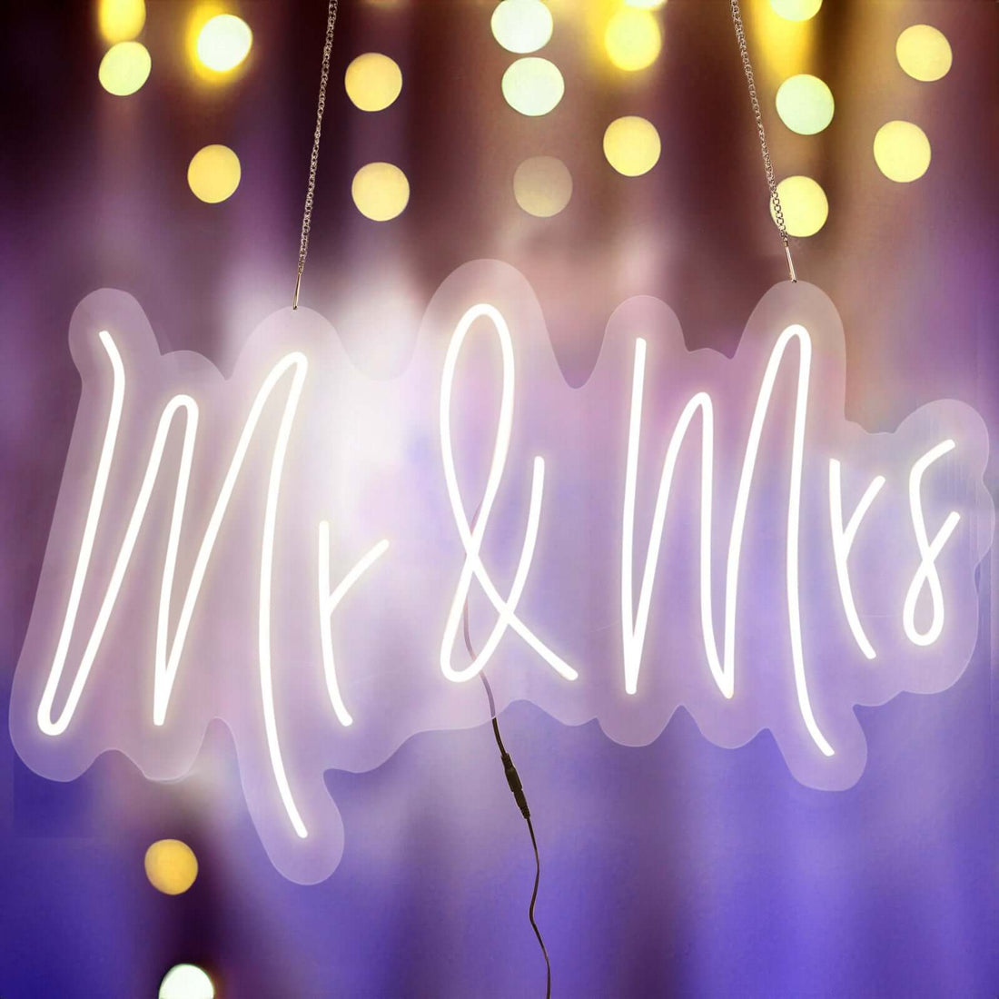 "Mr & Mrs neon sign with soft bokeh lights in the background"