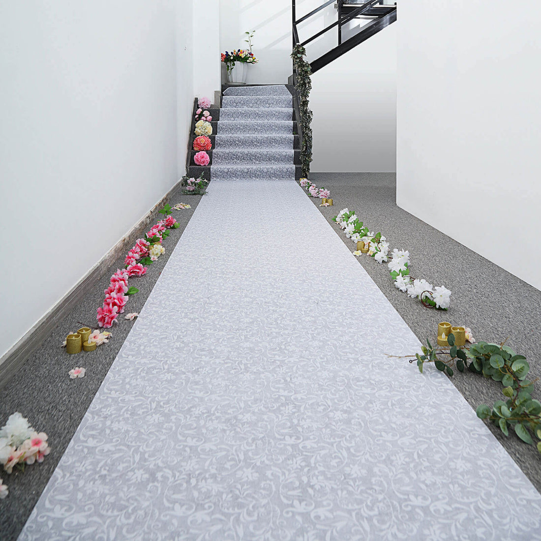 Decorative floral aisle runner on a staircase with flowers along the edges.