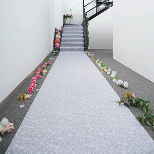 Decorative floral aisle runner on a staircase with flowers along the edges.