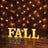 Decorative "FALL" marquee letters against a brick wall with string lights.