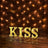 KISS marquee letters with warm lights on a brick wall backdrop.