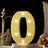 Illuminated marquee letter "O" with lights on a decorative table setting.