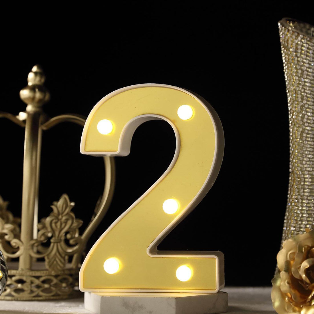 Number 2 light-up marquee sign with yellow finish and LED bulbs.