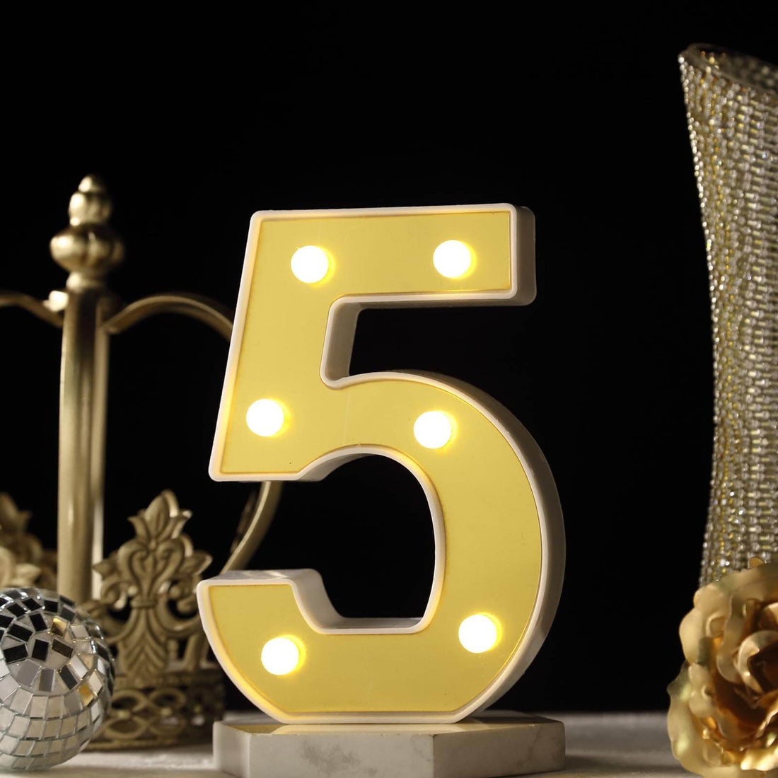 Illuminated number 5 decorative light with bulbs, ideal for events or celebrations.
